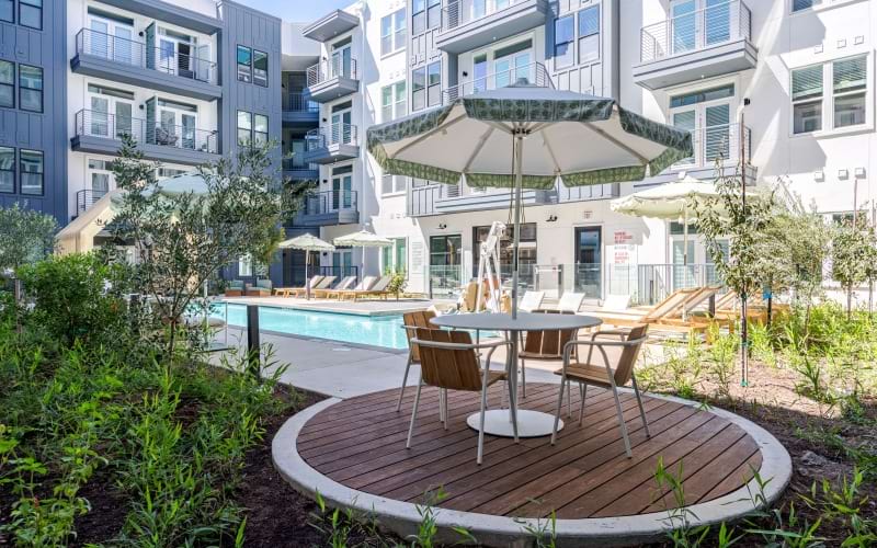 Exterior of Windsor Commons pool with umbrella