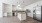 kitchen showcasing green backsplash, island, and built-in desk and shelves